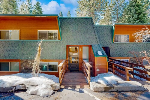 Forest-view condo with wood fireplace & walkable locale - dog-friendly