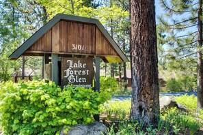 A wooden sign with 'Lake Forest Glen' and a number '3101' indicating a location. - Bright condo with outdoor pool, hot tub, tennis, sauna & patio - walk to lake (Tahoe City)