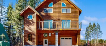 Family-friendly, lakefront getaway with a gas fireplace, furnished deck, & views
