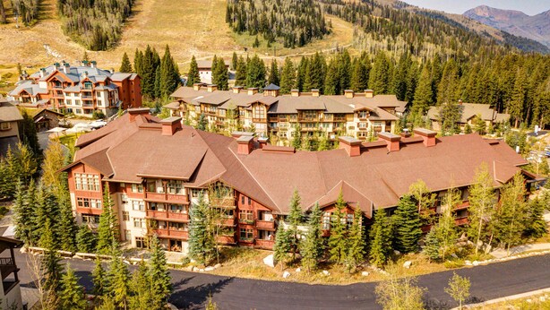 A lodge with multiple buildings, surrounded by trees and mountains. - Ski-in - ski-out Condo with Shared Pool, Hot Tub & More - Awesome Views (Solitude)