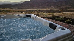 A hot tub with a mountainous landscape in the background. - Stunning townhome with  unobstructed views, amenities for the health conscious (Heber City)