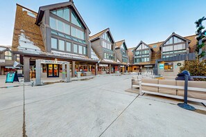 A commercial area with a variety of storefronts, including a visible restaurant named 'Jackson's Base Camp.' - Lovely Ski-in - ski-out studio with pool, hot tub, sauna & fireplace - walk to lifts (Park City)