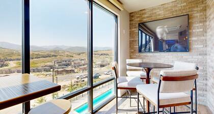 Modern resort condo with pool, hot tub + shuttle service