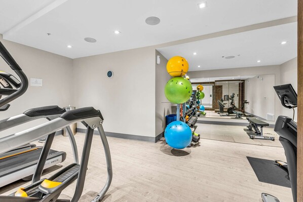 A gym with treadmills, exercise balls, and various fitness equipment. - All-Suite Ski-In,Ski-Out Haven with Lavish Interior, Heated Pool & 2 Hot Tubs (Park City)