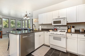 Fridge, microwave, oven, stovetop - Light-filled condo with heated pool & hot tub, near shopping & skiing (Park City)