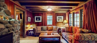 Unwind in nature's embrace at a 1925 cabin with hot tub & river views