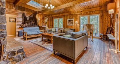 Rustic lodge with private hot tub, fireplace & riverfront views - dog-friendly