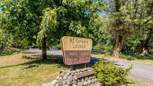 A sign for BZ Corners LAUNCH with a stone base and a plaque for the U.S. Department of Agriculture. - 2-story dog-friendly cabin near White Salmon River with mtn views, courtyard, AC (White Salmon)