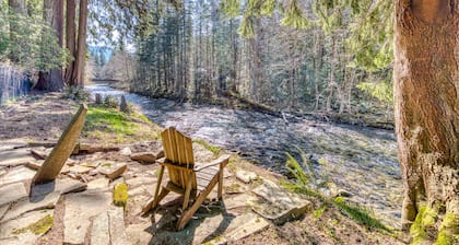 Dog-friendly, riverfront home with a wood-burning fireplace & views