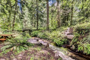 Outdoor dining - Dog-friendly creekside home with entertainment barn, private hot tub & firepit (Rhododendron)