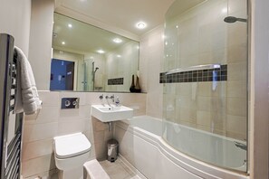 Shower, hair dryer, towels, toilet paper