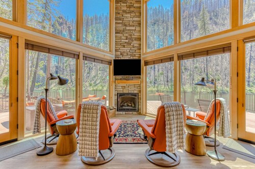 Unique riverfront home + cabin with amazing views, deck, & W/D - dog-friendly