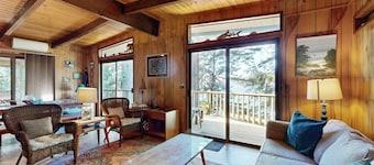 Unique lakefront cabin near the dunes with a private dock & fireplace