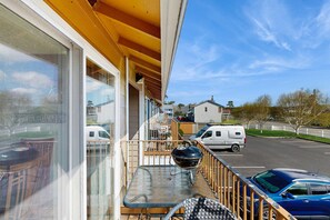 Outdoor dining - Dog-friendly condo by the beach & close to downtown with river views (Seaside)