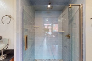 A glass-enclosed shower with a tiled floor and walls, a visible door handle, and a ceiling light fixture. - Family- and dog-friendly loft with fast WiFi & full kitchen - walkable location (Joseph)