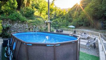 Seasonal outdoor pool, pool loungers
