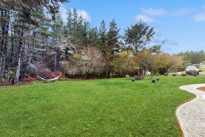 Property grounds - Lower level w/ private hot tub, fire pit, grill, & beach access - dog friendly (Long Beach)