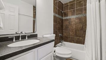 Shower, hair dryer, towels, shampoo