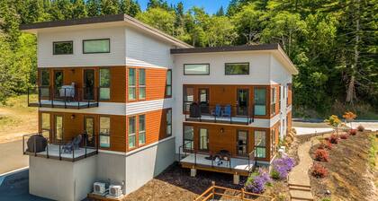 Sunny apartments with fireplace, partial ocean views, washer/dryer, grill & AC