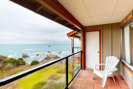 Property grounds. Sweeping Oceanfront Views Await Tranquil Condo with Balcony, Beach Access, W&D