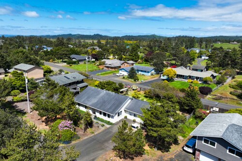 Charming home near ocean with patio, firepit, WiFi, streaming, and wood stove