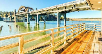 Incredible Riverfront Oasis with Wraparound Deck & Cozy Interior