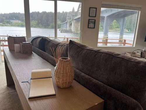 Incredible Riverfront Oasis with Wraparound Deck & Cozy Interior
