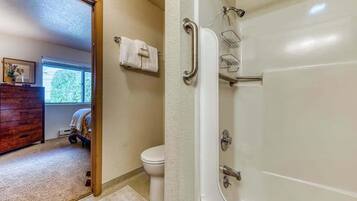 Shower, hair dryer, towels, shampoo