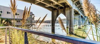 Incredible Riverfront Oasis with Wraparound Deck & Cozy Interior