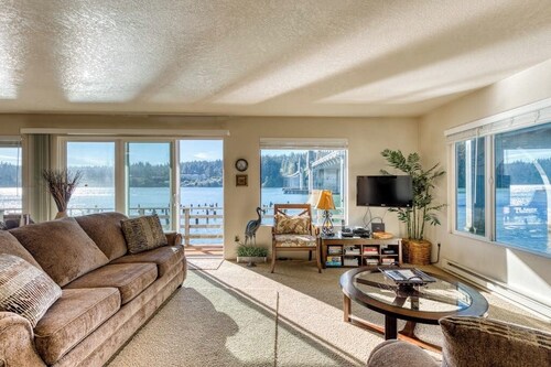 Incredible Riverfront Oasis with Wraparound Deck & Cozy Interior