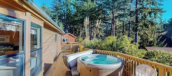 Cozy abode steps from the beach with a private hot tub and nautical theme