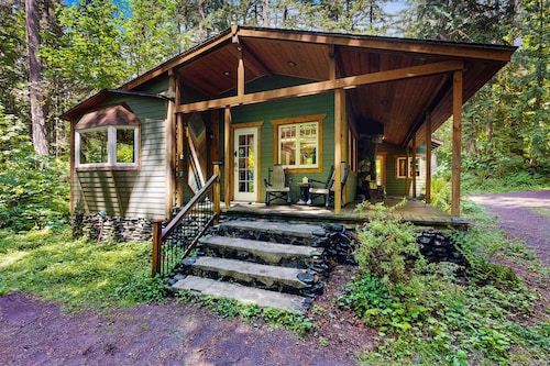 Cozy Riverfront Cottage with Charming Interior & Hot Tub - Dog-Friendly