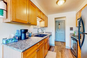 Fridge, microwave, oven, stovetop - Updated condo with river view, convenient location, & private balcony (Seaside)