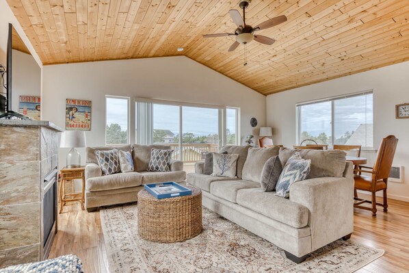 TV, fireplace, offices - Serene riverfront home with gas fireplace, W/D, balcony, patio, & board games (Seaside)