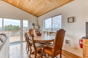 Dining - Serene riverfront home with gas fireplace, W/D, balcony, patio, & board games (Seaside)