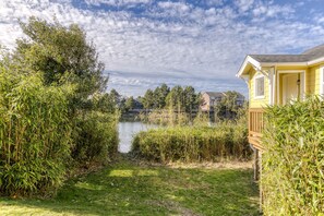 Exterior - Serene riverfront home with gas fireplace, W/D, balcony, patio, & board games (Seaside)