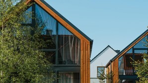 A modern building with large windows and wooden framing. - Luxury holiday home with terrace, sauna, jacuzzi (Niechorze)