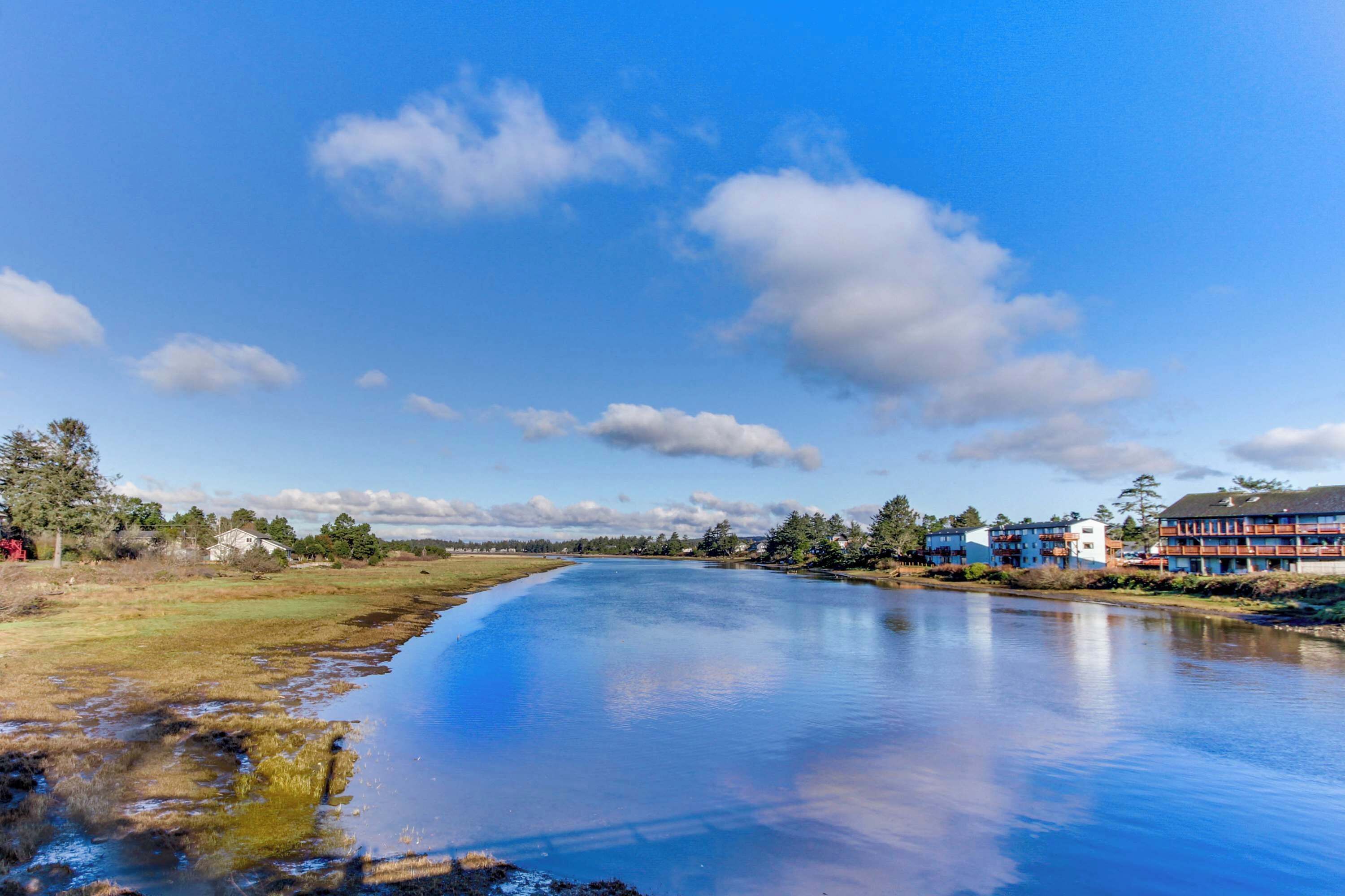 A river with a building complex on the right.