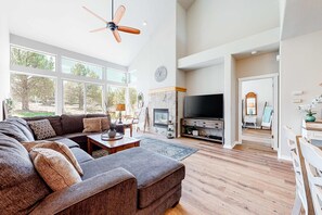 TV, fireplace - Dog-Friendly Home with Private Hot Tub, High-Speed WiFi, Shared Pool, & Central AC (Eagle Crest)