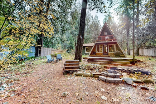 Dog-friendly A-frame near the river with game room, firepit, wood stove, & grill