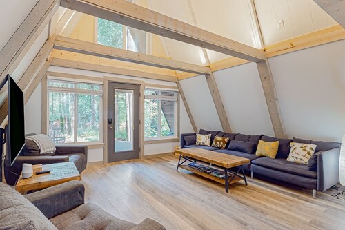 Dog-friendly A-frame near the river with game room, firepit, wood stove, & grill