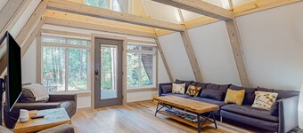 Dog-friendly A-frame near the river with game room, firepit, wood stove, & grill