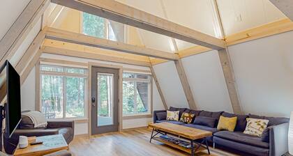 Dog-friendly A-frame near the river with game room, firepit, wood stove, & grill