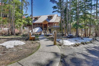 Riverfront mountain townhouse with pool & hot tub, patio, & easy ski access