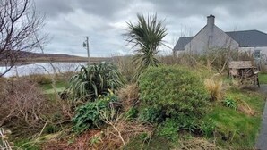 Property grounds - Charming Stone Cottage with Beautiful Gardens in the Heart of North Uist (HM2X+WH Isle of North Uist, United Kingdom)