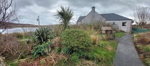 Property grounds - Charming Stone Cottage with Beautiful Gardens in the Heart of North Uist (HM2X+WH Isle of North Uist, United Kingdom)