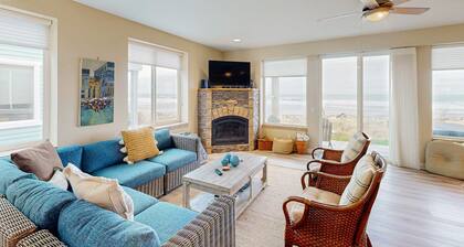 Modern oceanfront home with private hot tub, patio, & gas fireplace
