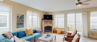 Modern oceanfront home with private hot tub, patio, & gas fireplace