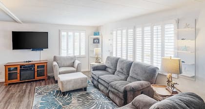 Retro-chic retreat near the beach with a fenced yard & deck, & washer/dryer