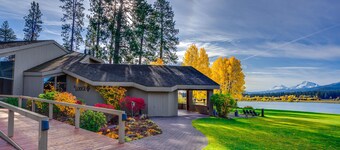 Resort home with pool, hot tub, three-tier decks, & golf course views